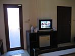 Promtsuk Buri - Bungalow <br> Main door, bathroom door, TV and mini-bar Promtsuk Buri - Bungalow <br> Main door, bathroom door, TV and mini-bar